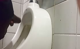 Caught a Dominican with a big cock masturbating in front of a urinal